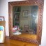 un-miroir-ancien-sur-cadre-bois-sculpte