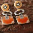 splendides-boucles-d-oreilles-etoile-d-argent-orange